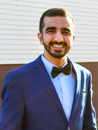 Harsh Deepak Kansara smiling for the photo