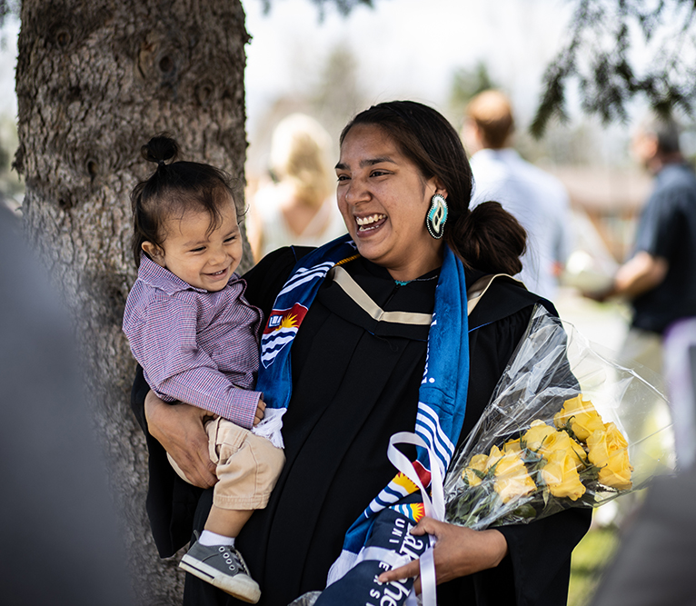 Graduate Jamie Manitowabi recieves her honours bachelor of commerce