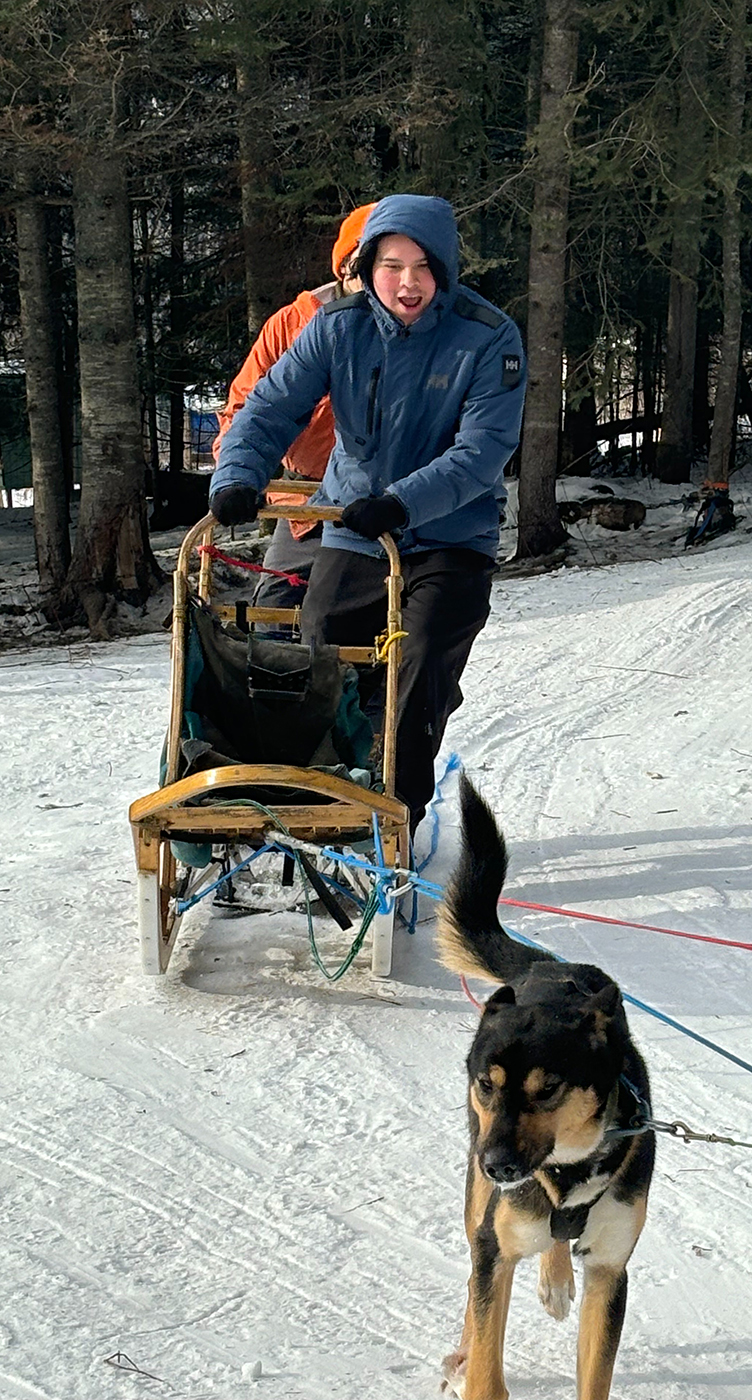 Students dog sledding