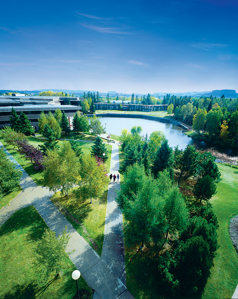 A scenic photo from above lake Tamblyn looking onto Thunder Bay campus