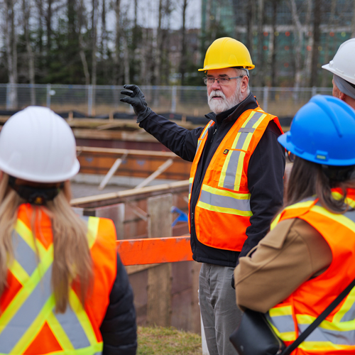 A member of our physical plant team coordinating construction of a new facility.