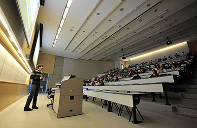 A professor speaking in front of a class
