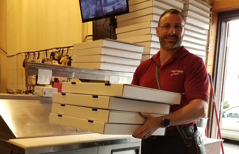 David Bruno carrying some of Donato's delicious pizza out to be delivered