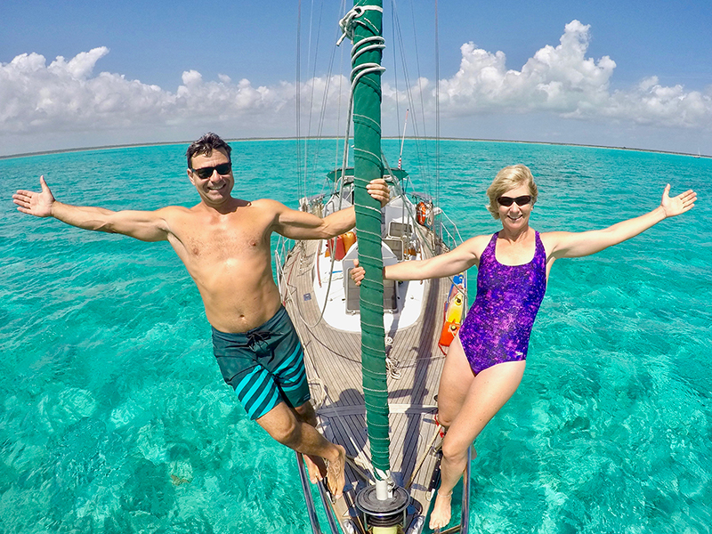 On the bow of Green Ghost, surrounded by the crystal-clear waters of Mayaguana, the easternmost of the Bahamas Islands.