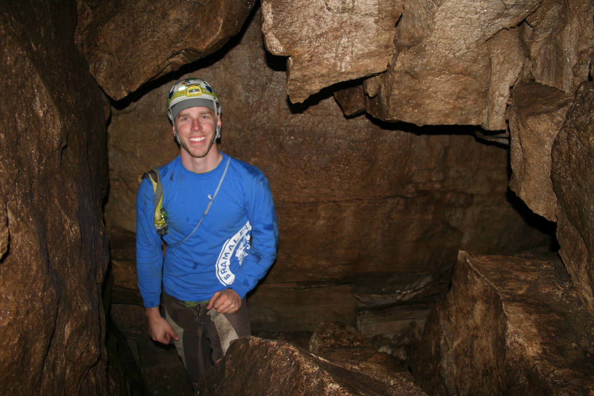 Carlin standing in a cave