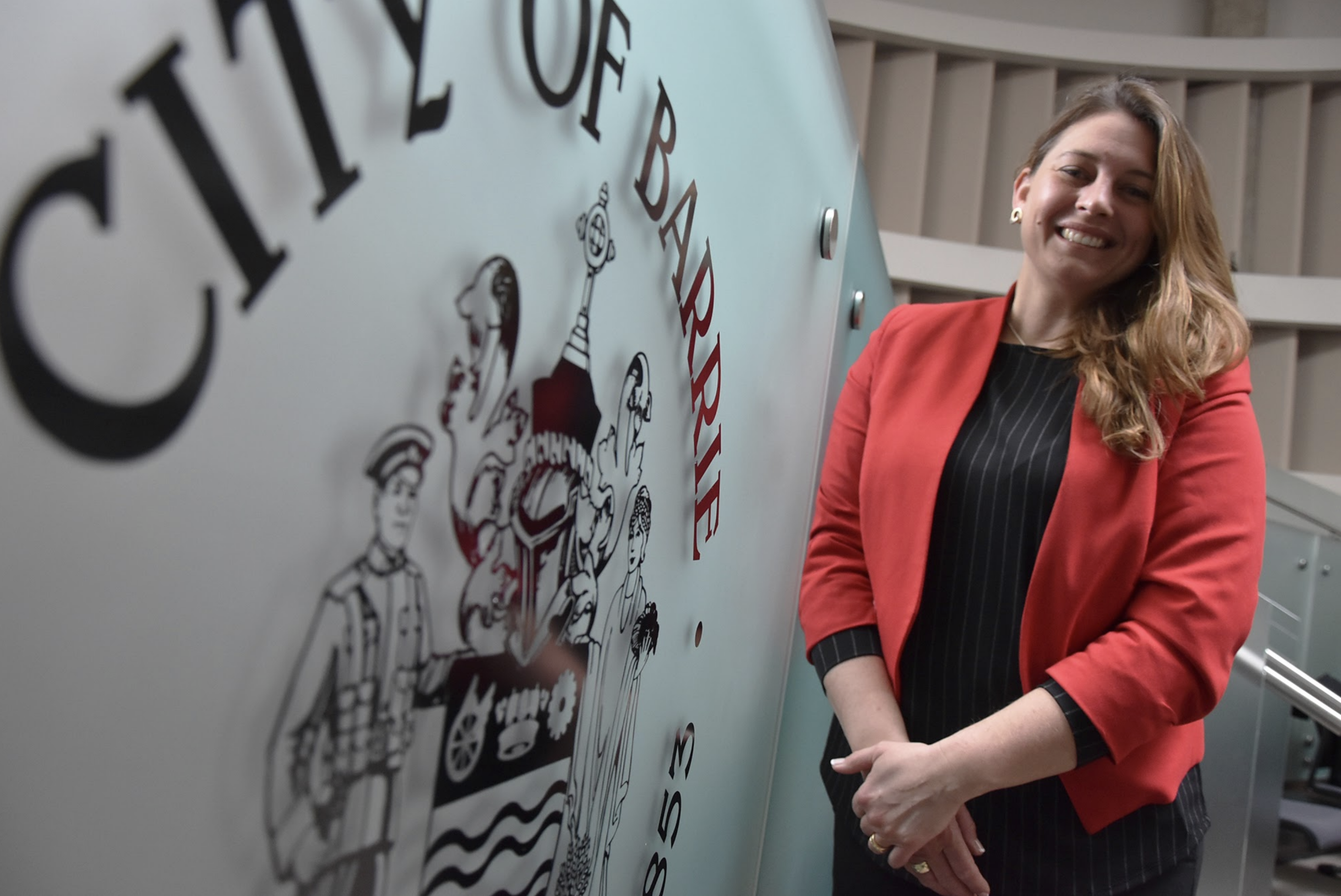 Ann-Marie stands by City of Barrie sign