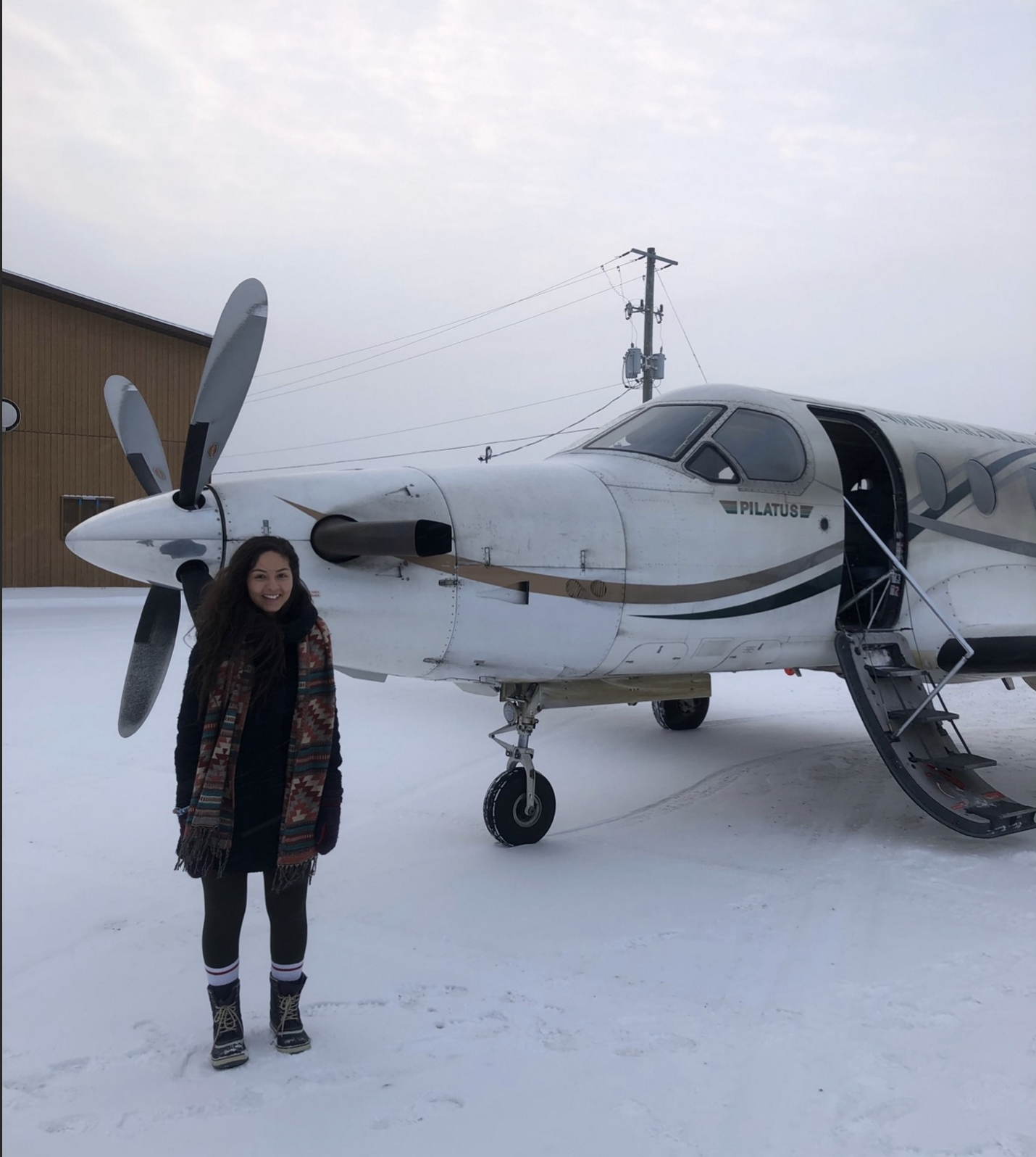Michaela boards a plane to work in Wabaseemoong First Nation