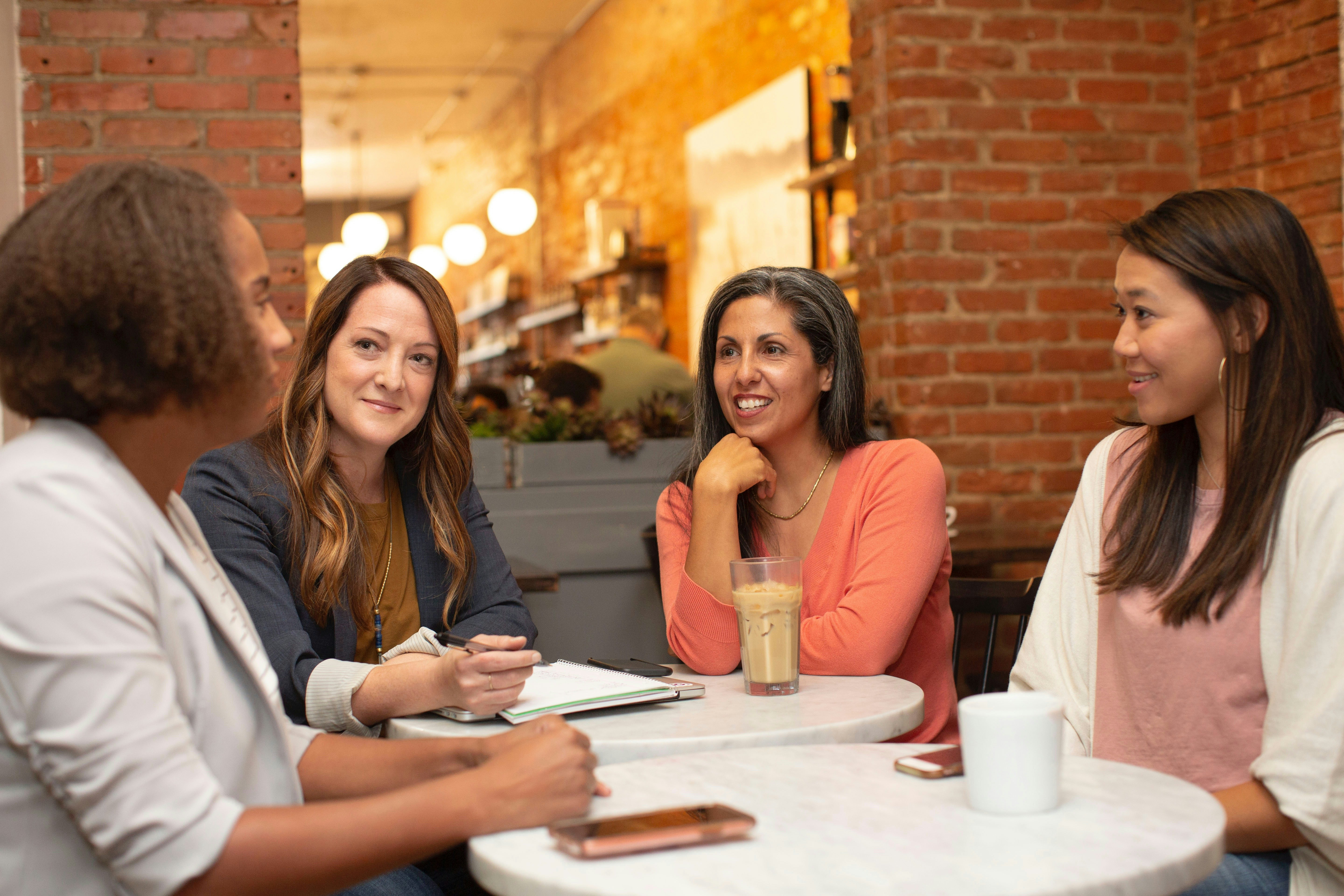 People networking around a table