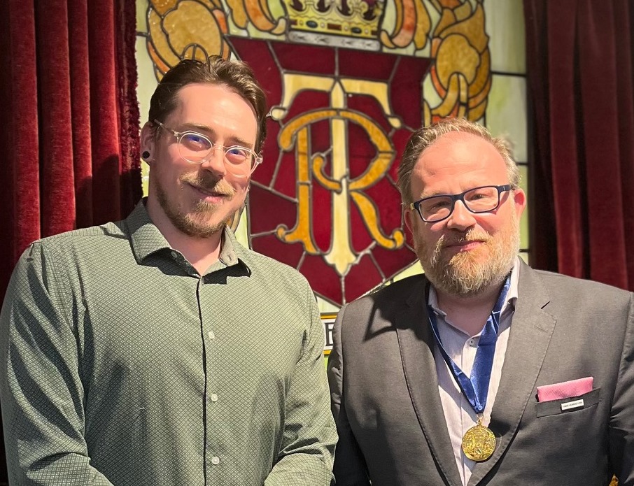 Daniel Dishaw congratulates Dr. Michel Beaulieu on his Cruickshank Gold Medal