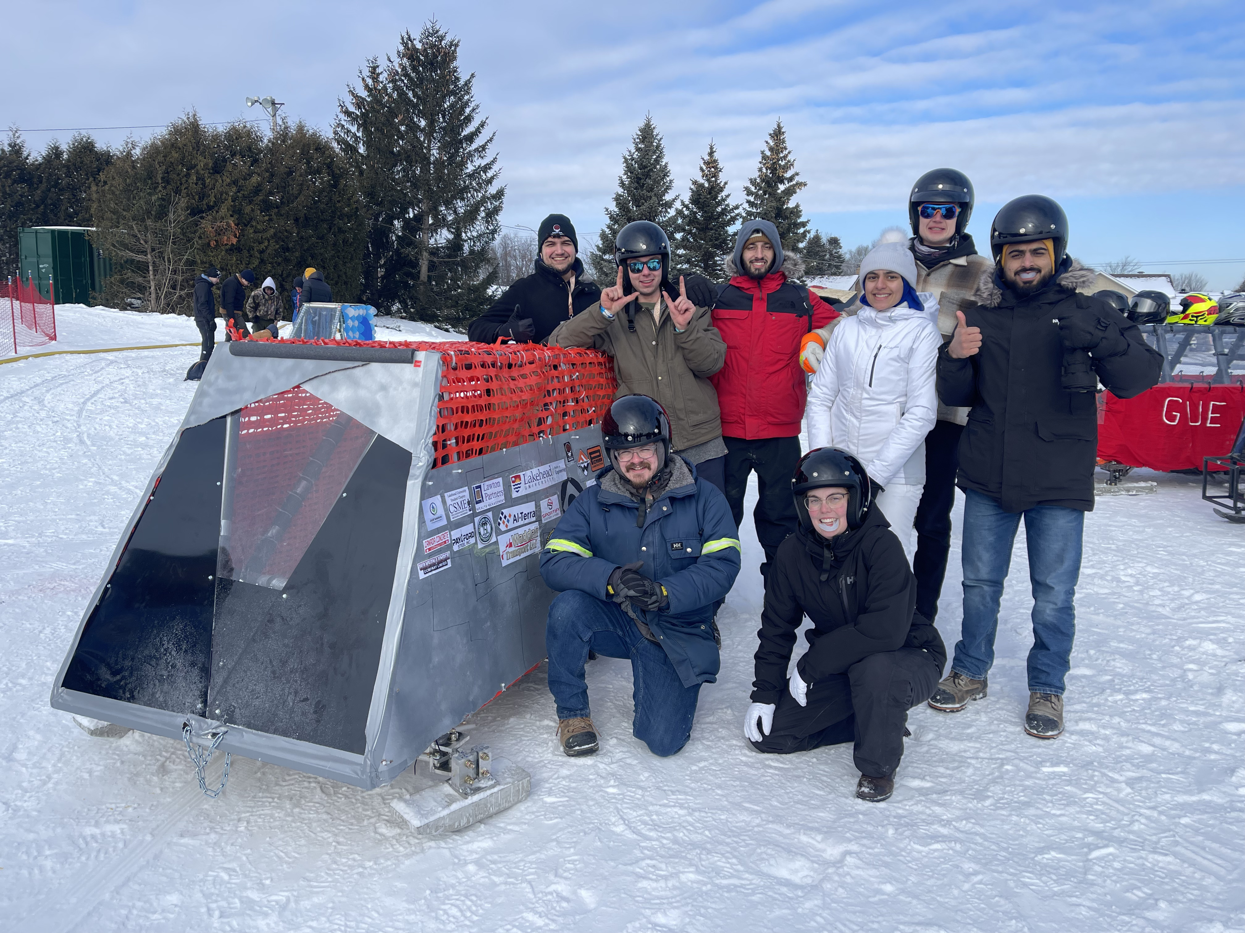 GNCTR team poses in front of their concrete toboggan
