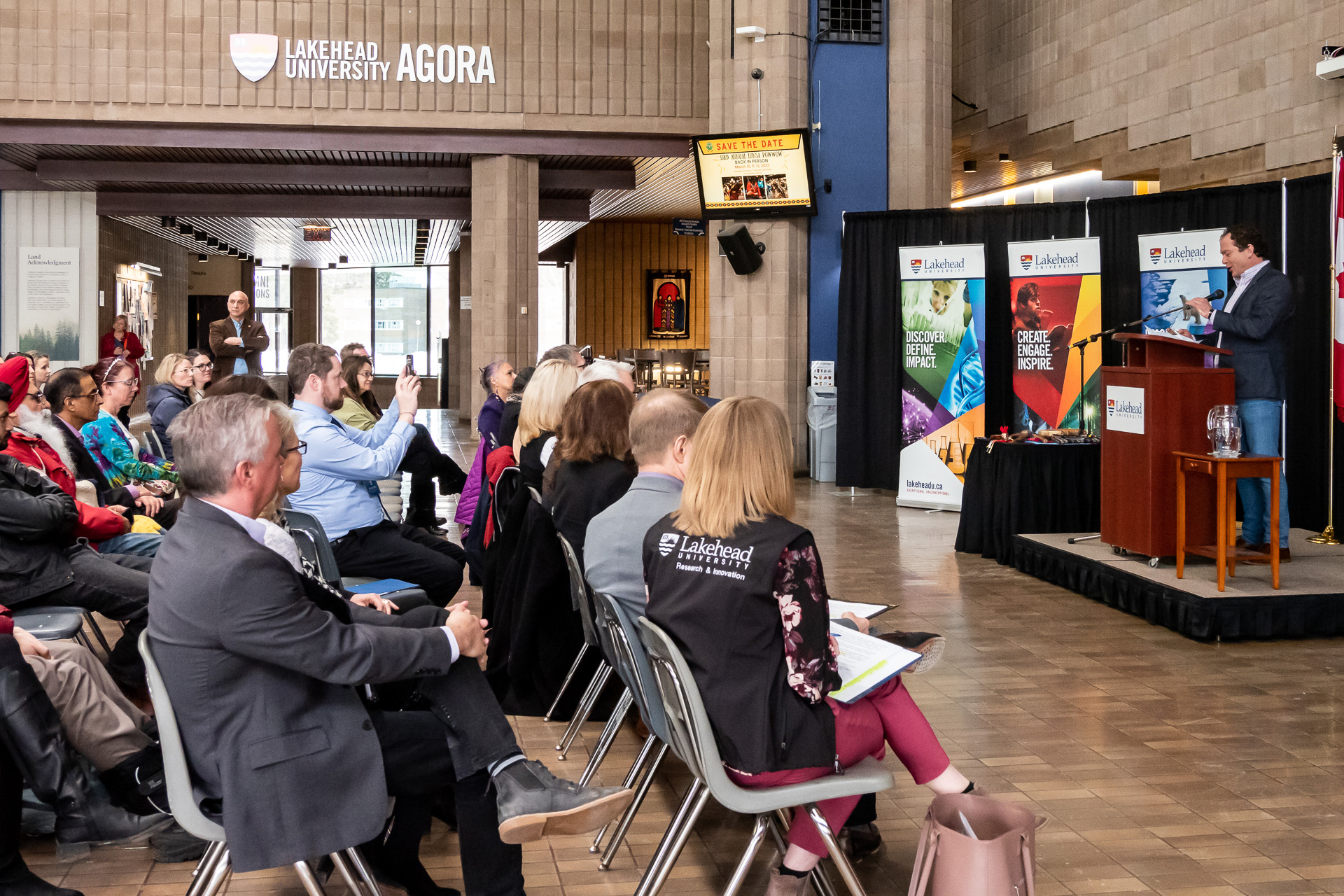 Visitors celebrate the Opening Ceremonies of Research and Innovation Week in the Agora