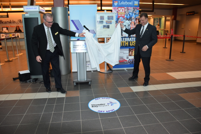 Ed Schmidtke (left) and Dr. Brian Stevenson unveiled the Art Spot at the Thunder Bay Airport. 