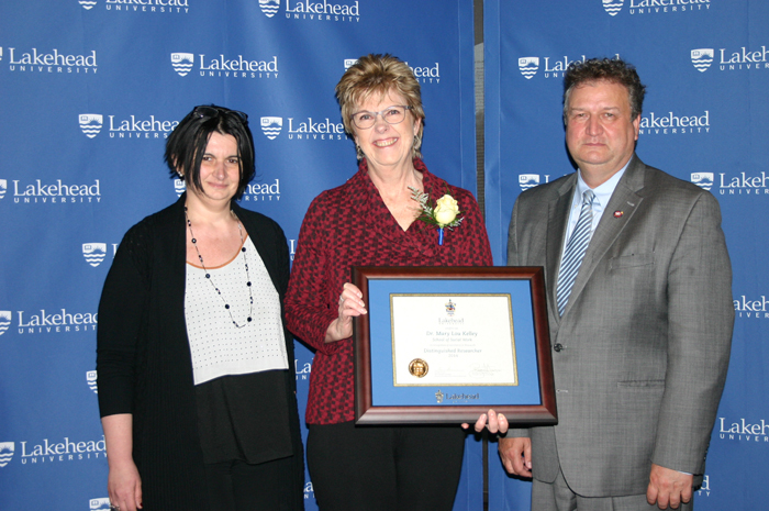 Mary Lou Kelley receives her award. 