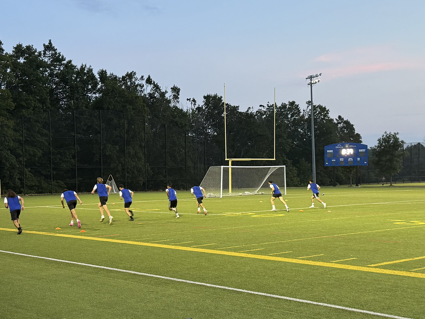 Student-athletes practice under the lights of the artificial turf field at the West Orillia Sports Complex. 