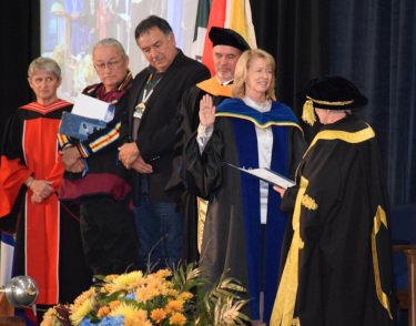 Photo of Chancellor Lyn McLeod performing Dr. Moira McPherson's installation