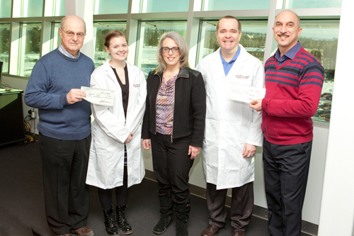 Roy Piovesana, far left, IIS-LU President, and John Bonofiglio, far right, Vice-President of IIS-LU, presented cheques to Margaret-Ashley Veall and Dr. Carney Matheson. In the middle is Laura Craig, Director of Research, Crupi Consulting Group.