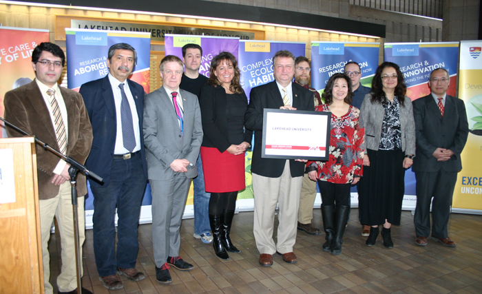 Dr. Brian Stevenson invited some of Lakehead's Canada Research Chairs to accept a certificate recognizing that the University demonstrated exemplary practices in recruiting CRCs in 2014. Also in the photo is Dr. Andrew Dean, Vice-President, Research, Economic Development and Innovation, third from left, and Michèle Boutin, Executive Director of the Canada Research Chairs program (left of Dr. Stevenson).
