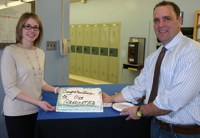 Graduates Melissa Blanchard, left, and Jean Begin celebrated their accomplishment with a cake.