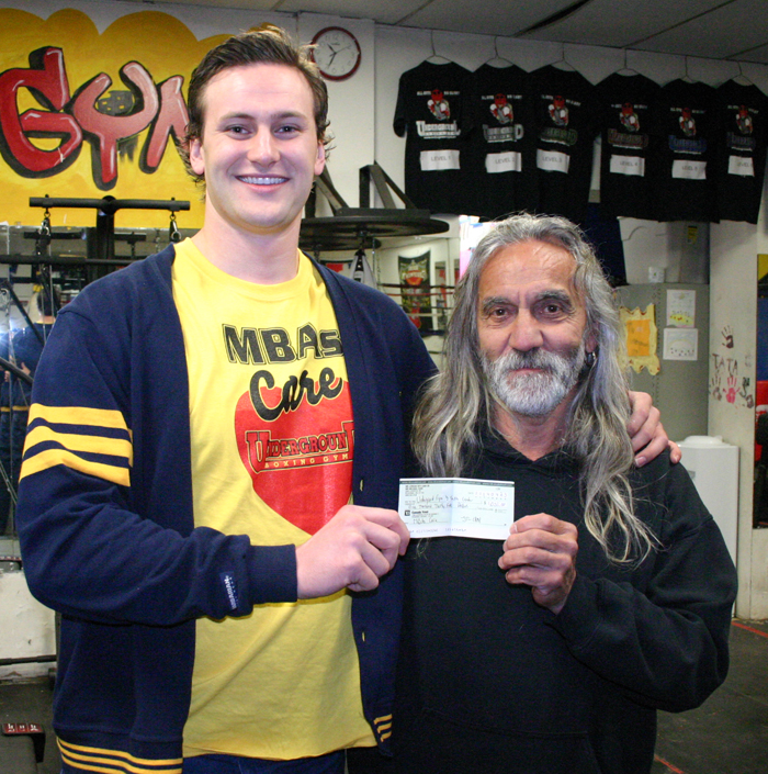 Jordan Cash, left, presented Peter Panetta with a cheque for $1,035 on Wednesday, April 23. Cash raised the money through a scholarship from Mirabelli Corp., and donations from other MBA students and Lakehead faculty.