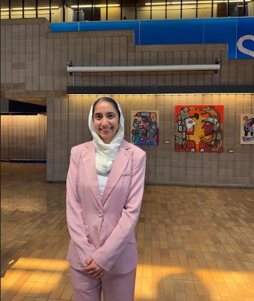 Simran Bedi standing in the Agora, a Lakehead University Building