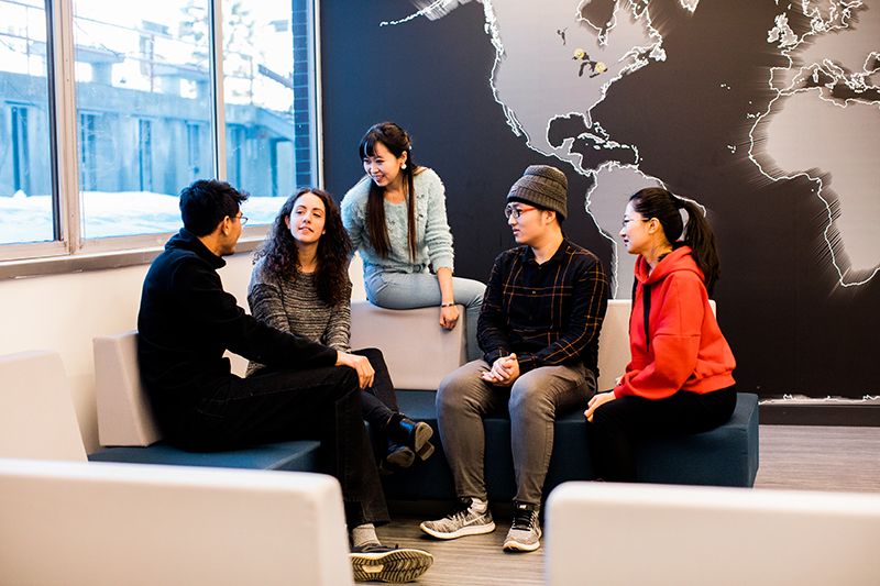 Students discussing in the Student Lounge