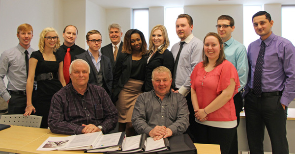 A graduating business class taught by Dr. Herman van den Berg at Lakehead University’s Orillia campus recently conducted a business study for Orser Technical Services of Orillia. Orser General Manager Ray Gammon and President Tony Telford (seated l – r) attended the final class in April to receive the students’ final reports and presentations.