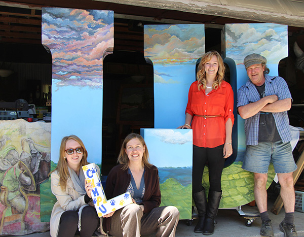 . Sami Pritchard, Lakehead’s CampU Coordinator (l to r), Liz Ross, Lakehead’s CampU Director, Nikki McBride, Lakehead Communications Assistant, and Paul Baxter, local “letter” artist
