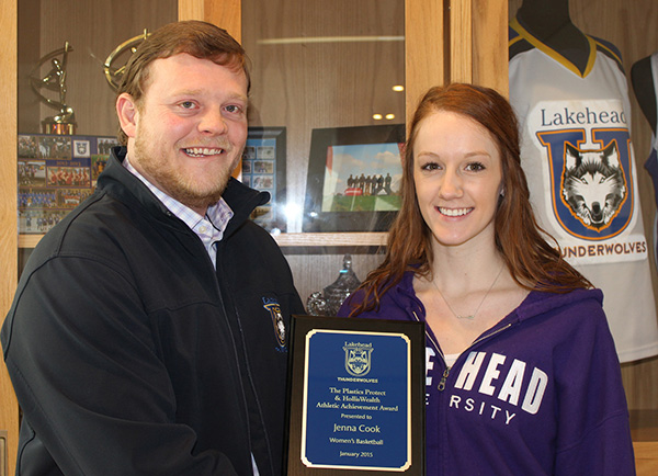 Lakehead Orillia’s Athletics and Recreation Facilitator, Neil Quinn, presents the Plastics Protect & Holliswealth Athletic Achievement Award for the month of January to Lakehead student and women’s basketball team member, Jenna Cook of Orillia.