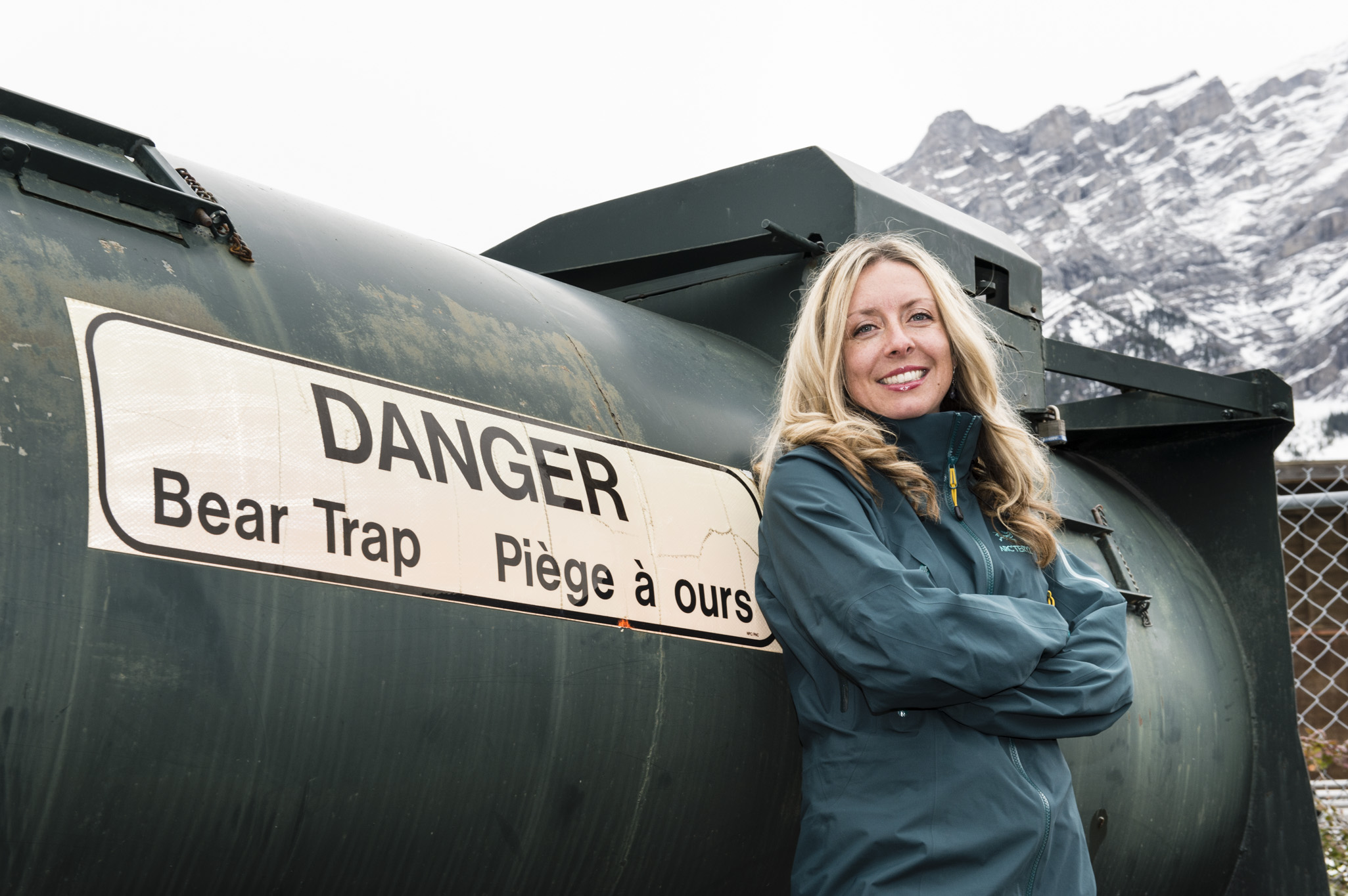 Kimberly Titchener leans against a bear trap container