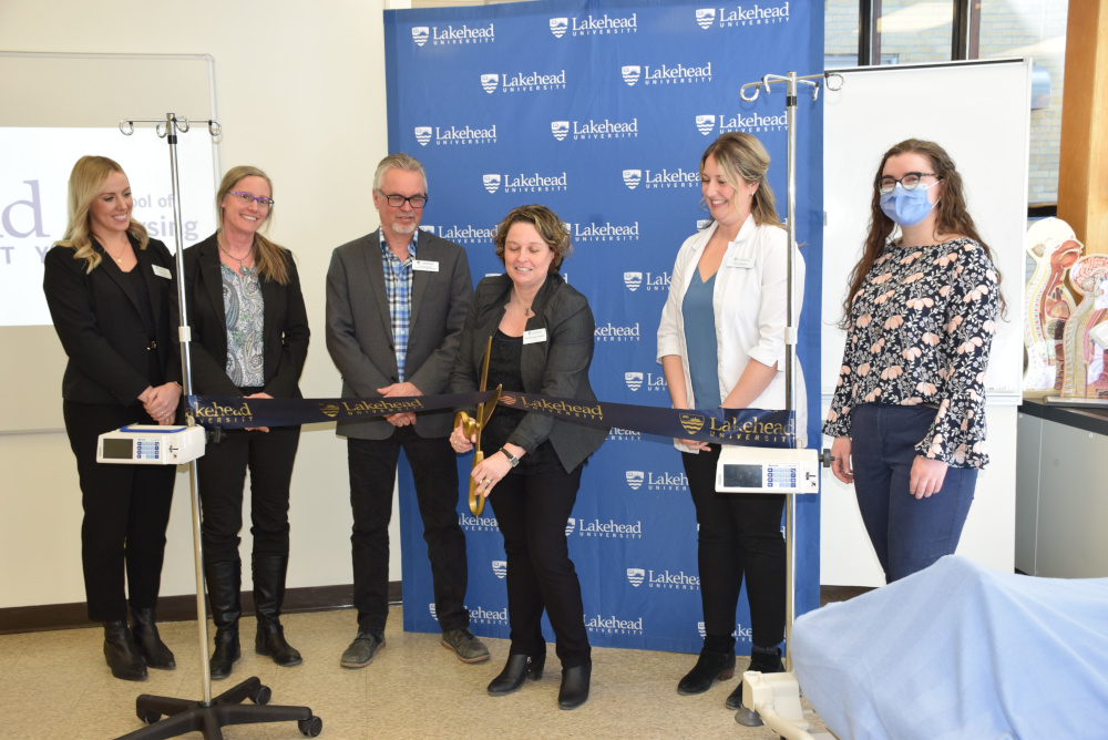 School of Nursing Director Dr. Kristen Jones-Bonofiglio cuts the ribbon at the grand opening of Lakehead's new nursing lab