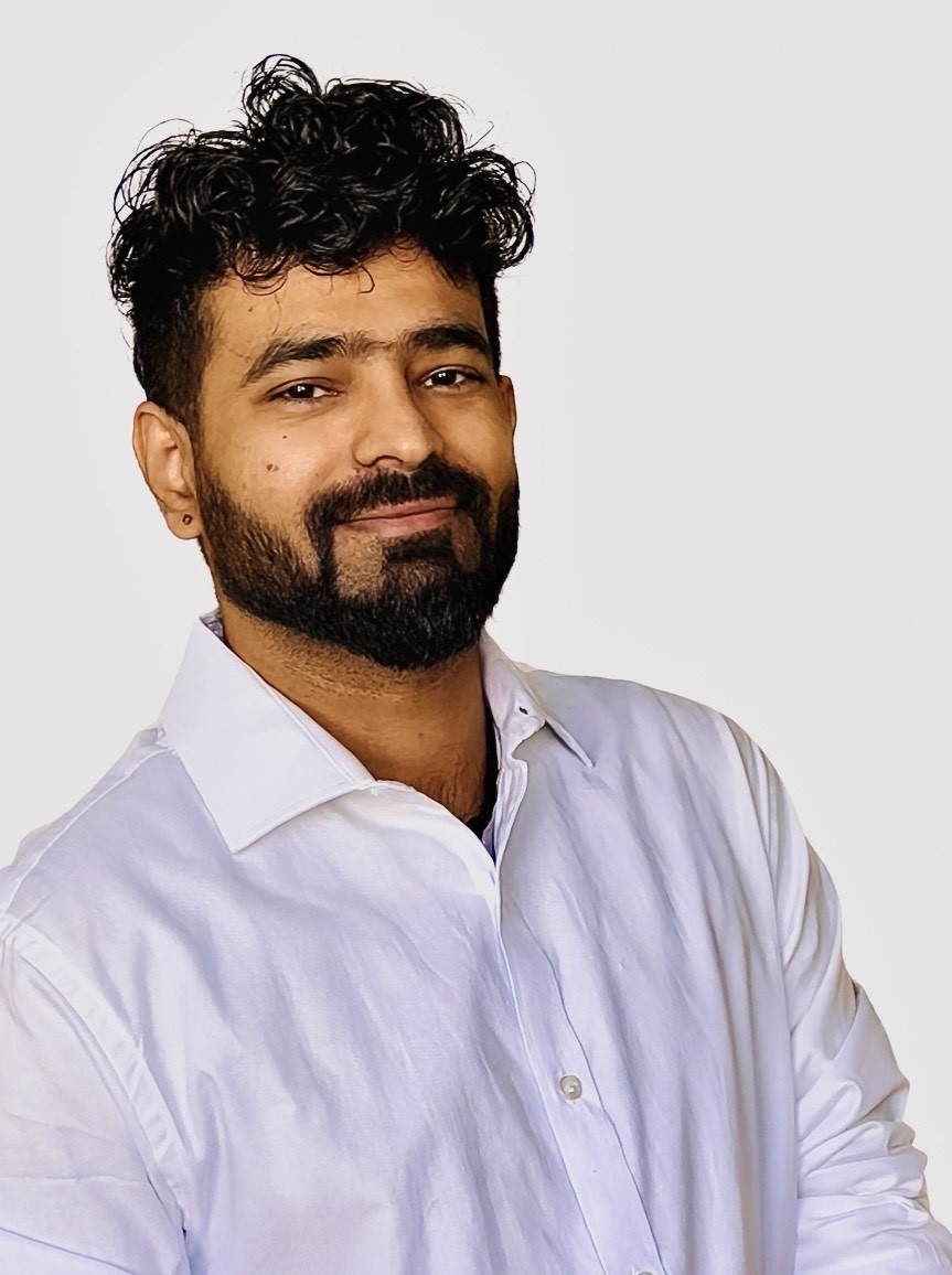 Mohit Dudeja wearing a white shirt