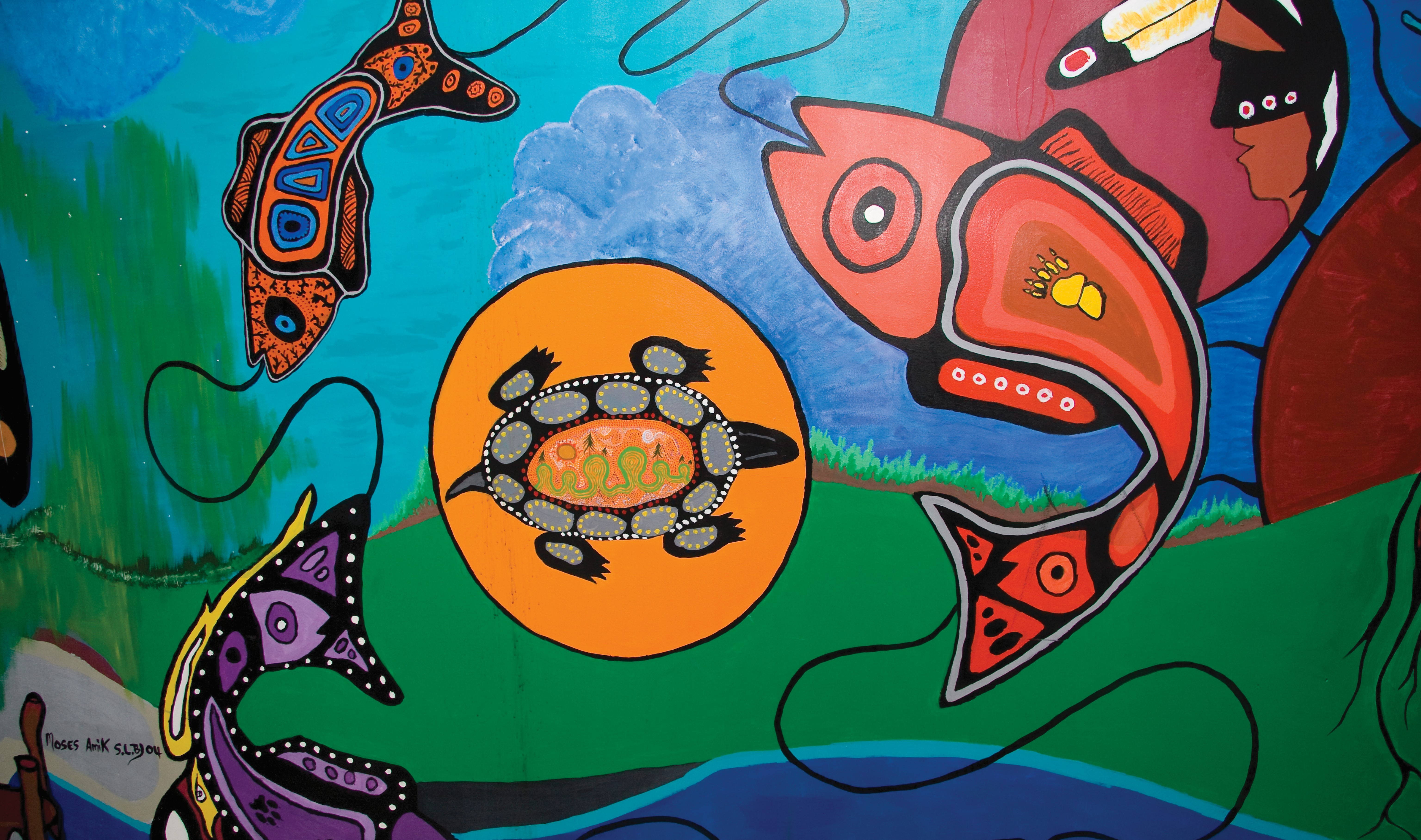 A brightly painted Woodland Style of Art wall mural featuring fish, a turtle, and a man