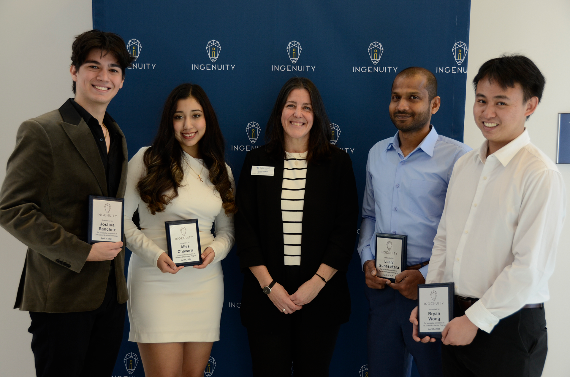 2024 Ascend Accelerator Graduates Joshua Sanchez, Aliss Chavarri, Lesly Gunasekara, and Bryan Wong hold Ascend Accelerator graduation plaques while standing next to Ingenuity Manager Alyson MacKay