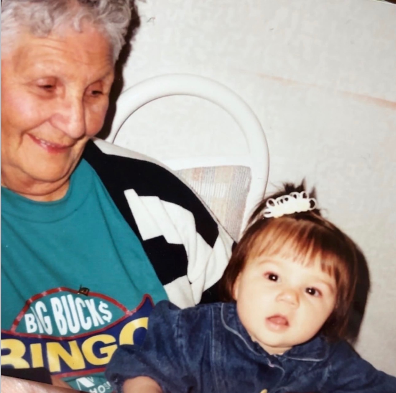 Céline Wick & Her Great-Grandmother Céline Wick's great-grandmother holds Céline, aged about 18 months, on her lap and smiles at her