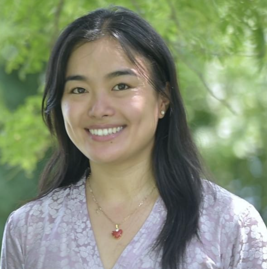 A head-and-shoulders image of Jigme Tsering standing outside with trees in the background
