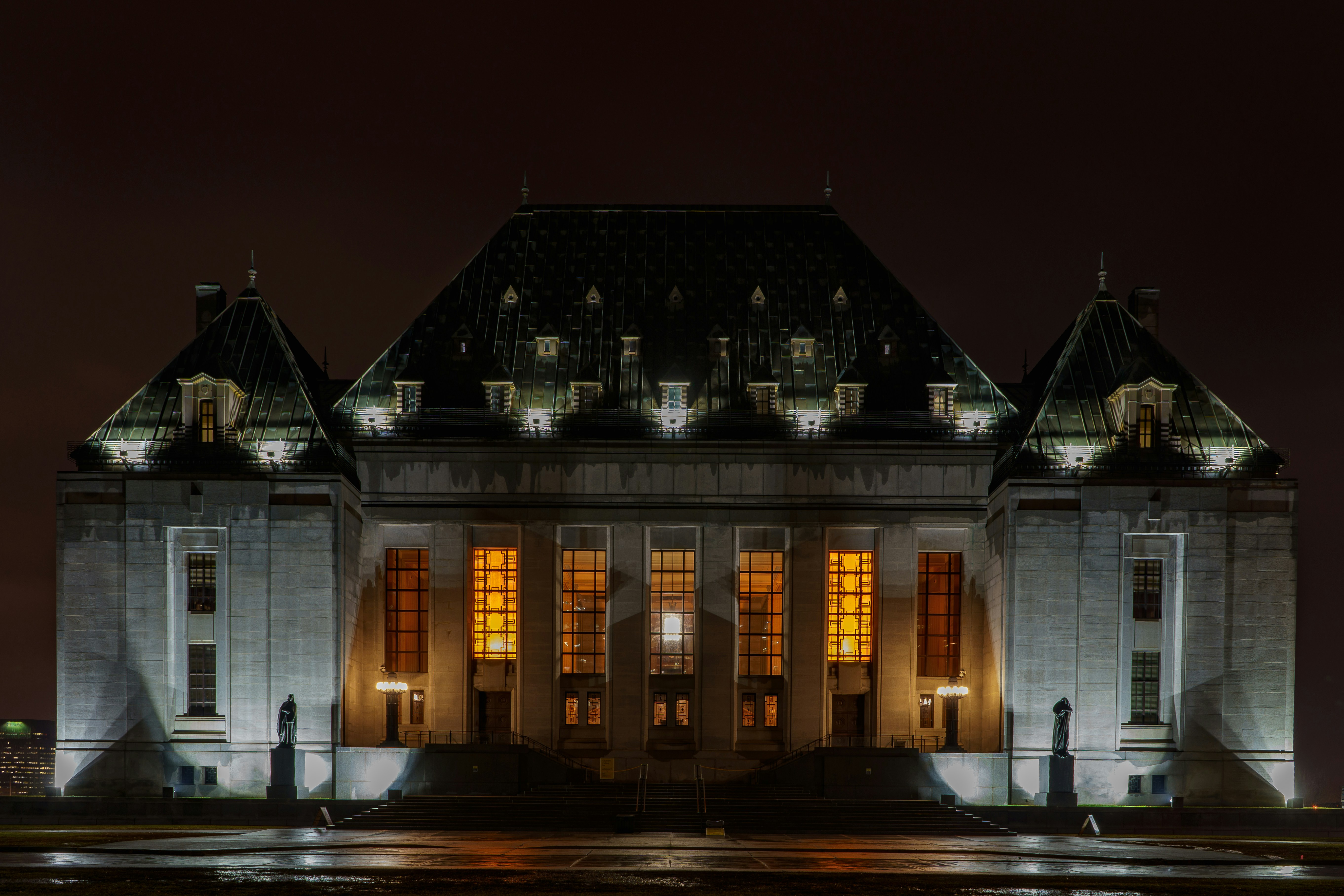 An exterior view of the Supreme Court of Canada at night