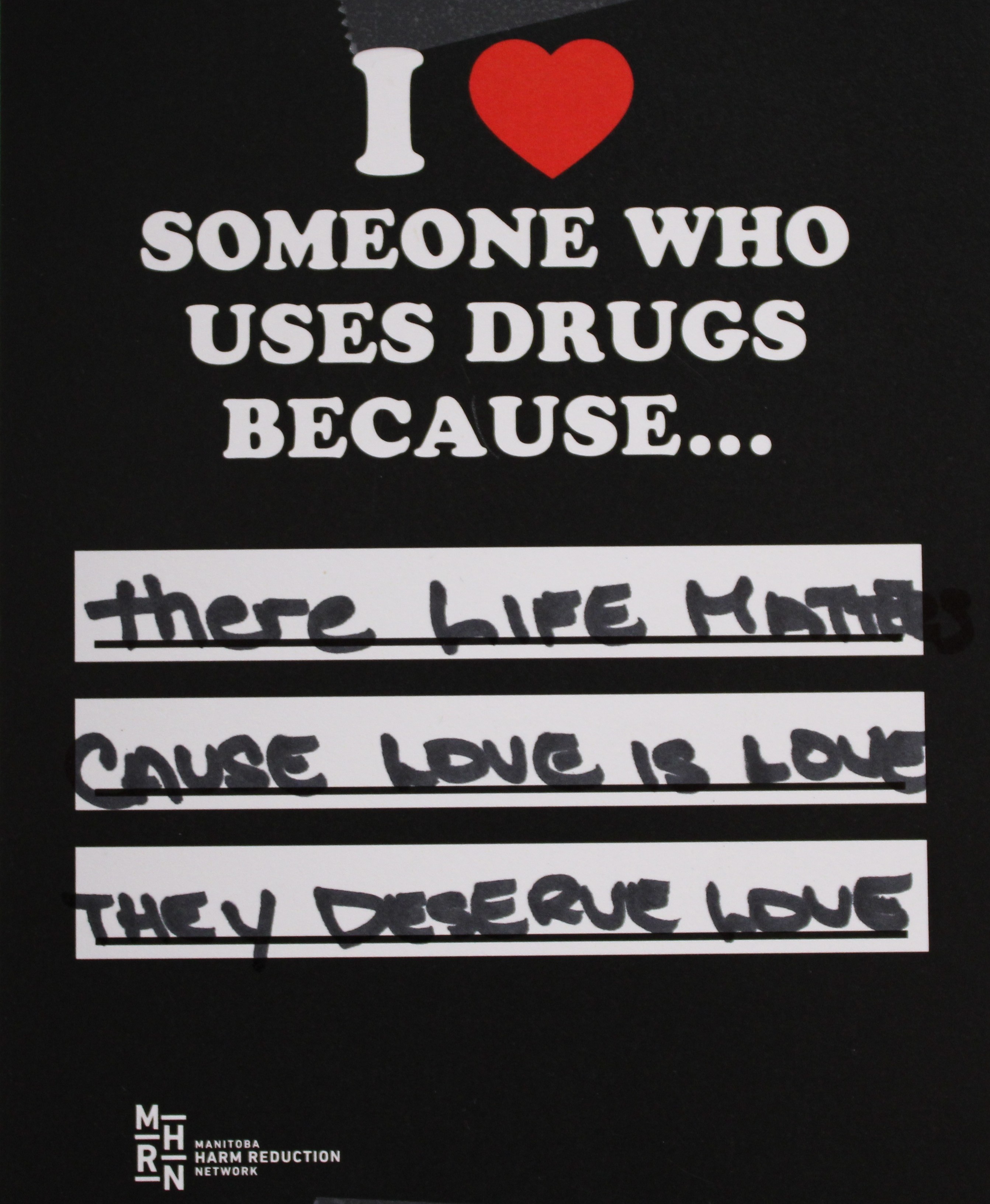 A poster saying "I heart someone who uses drugs because..." with reasons written below in marker