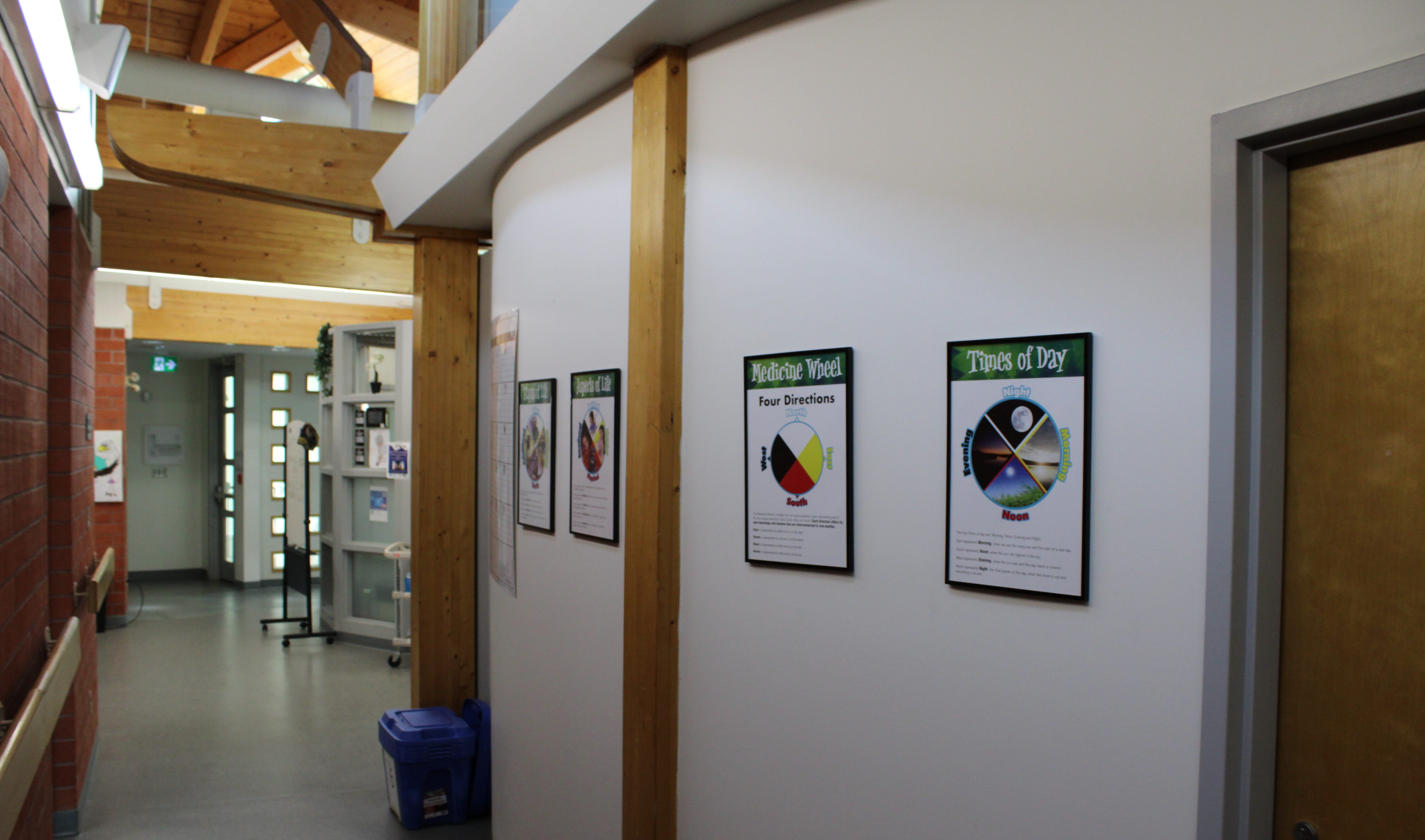 Interior View of the Thunder Bay Safer Supply Program Office A view of a curved hallway and the doorway of a building with a brick wall and wooden ceiling beams