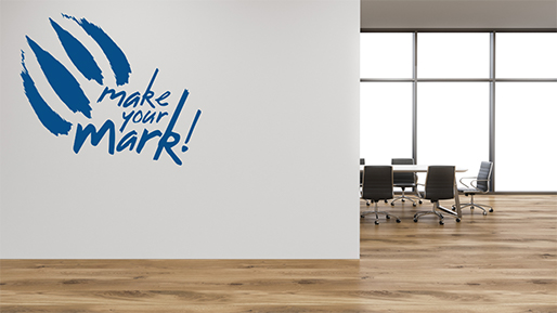 An office with the make your mark orientation logo on the wall