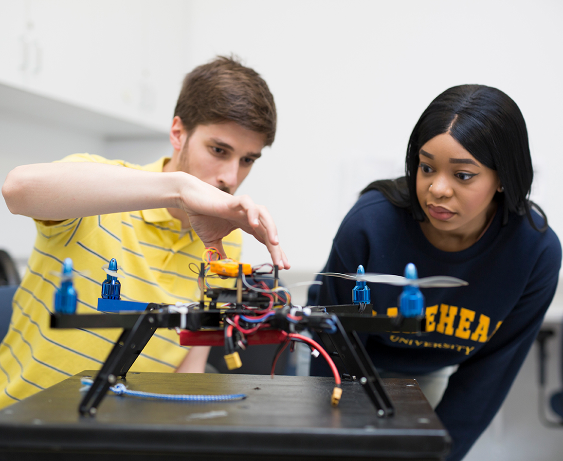 Two students with a drone