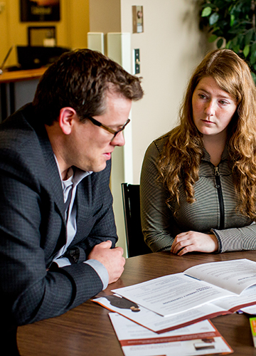 A staff member advising a student