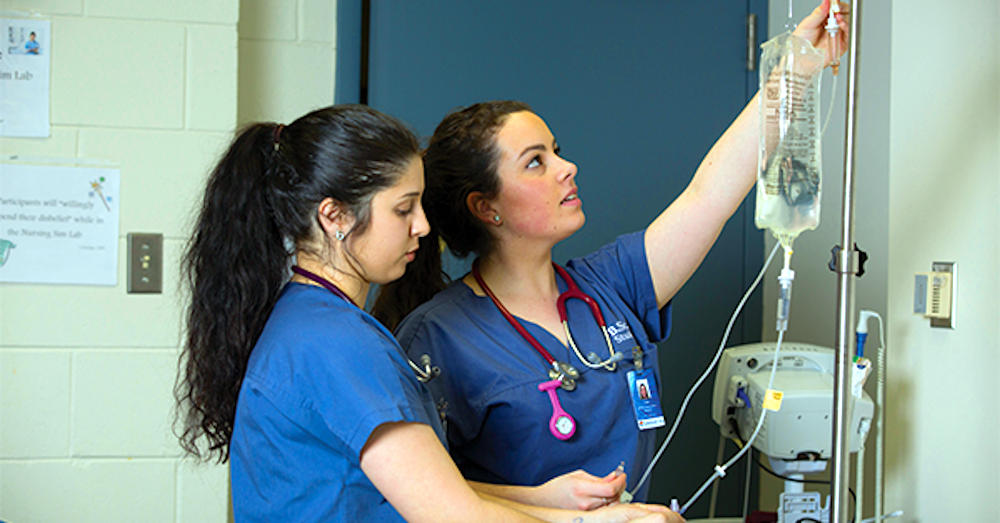 Students in Nursing class with hands on experience