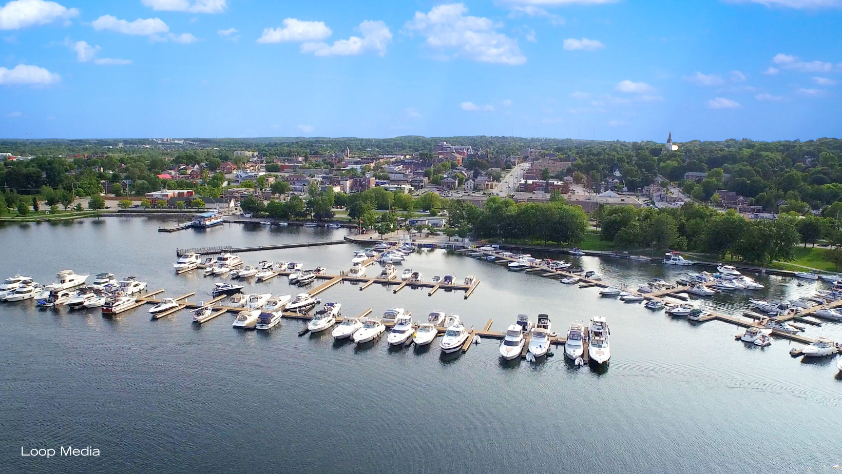 An aerial view of Orillia's downtown core and waterfront on a sunny day