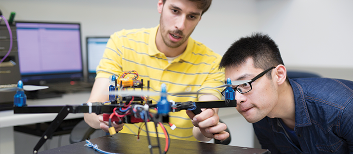 Students working with a drone in class