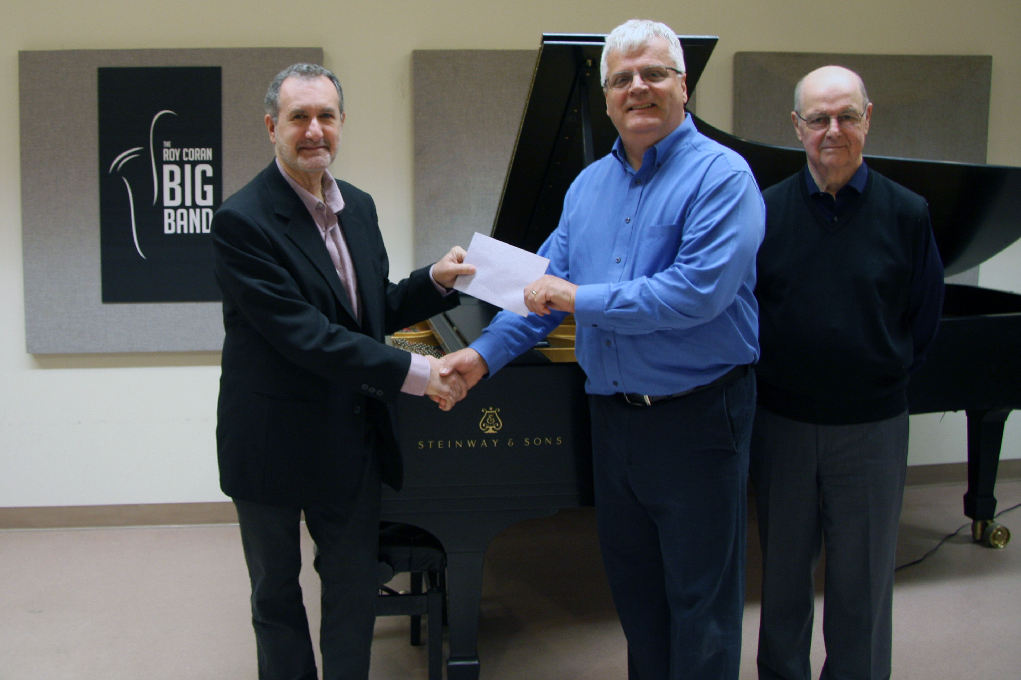 Dr. Aris Carastathis, Chair of Lakehead University's Music Department, Ted Vaillant, Director of the Roy Coran Big Band and Roy Piovesana, Band member and Fellow of Lakehead University