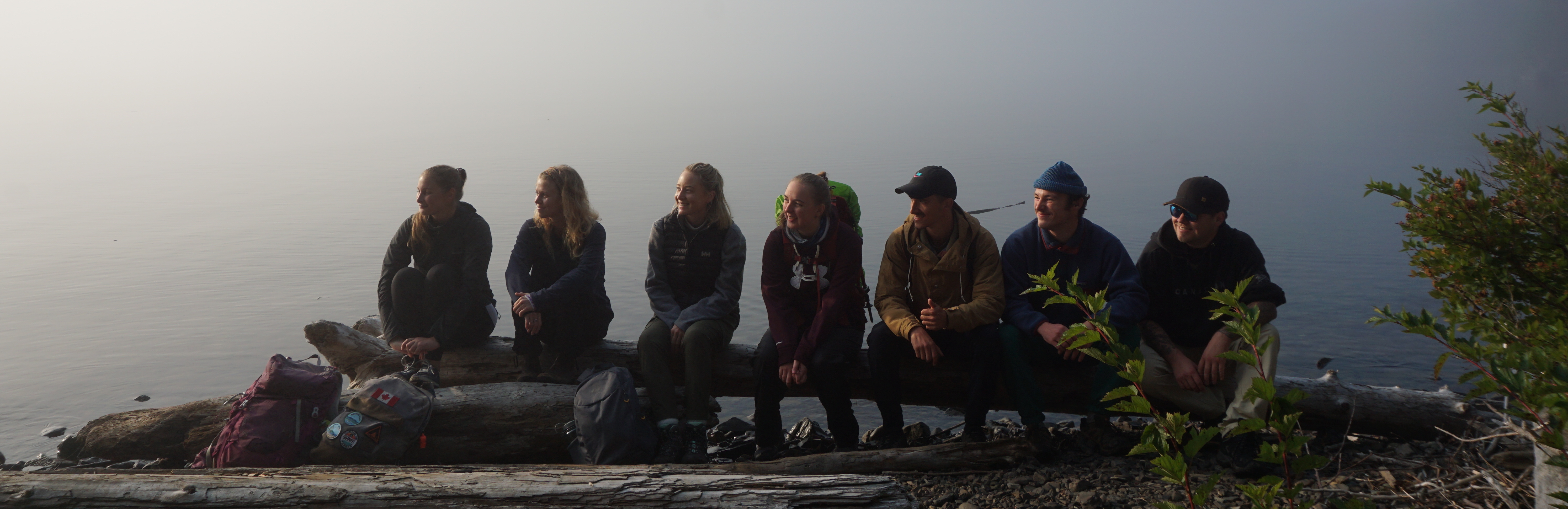 Students sitting by Lake Superior