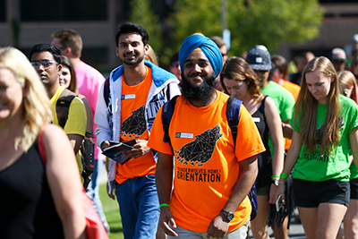 A photo of Students walking the Lakehead campus smiling